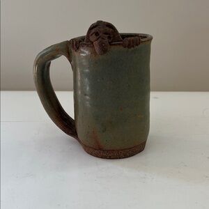 Vintage Art Pottery Mug with “Face and Hands Over the Wall”  character